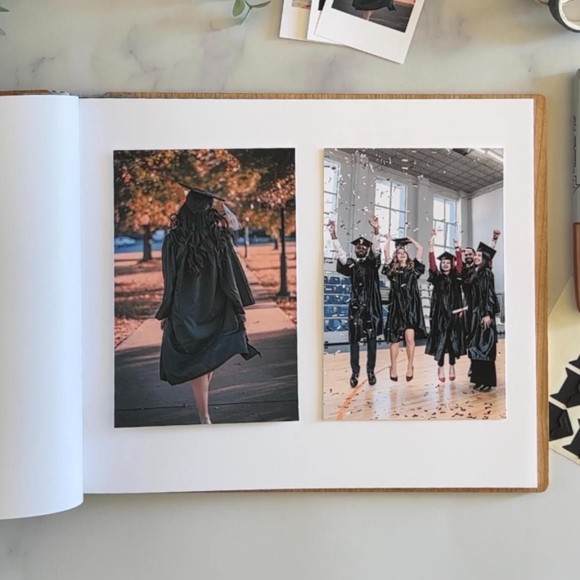 a book opened to a page with photos of graduates