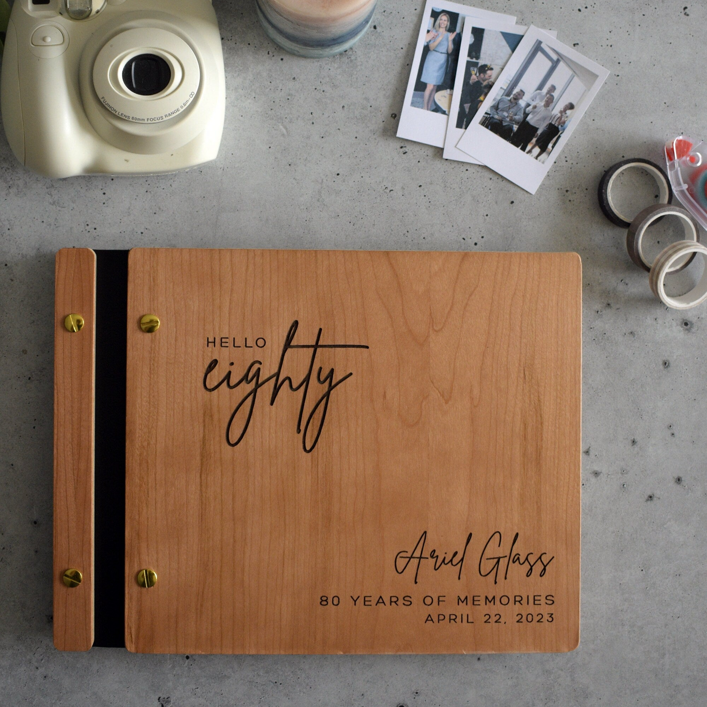 a wooden guest book with a couple's names on it