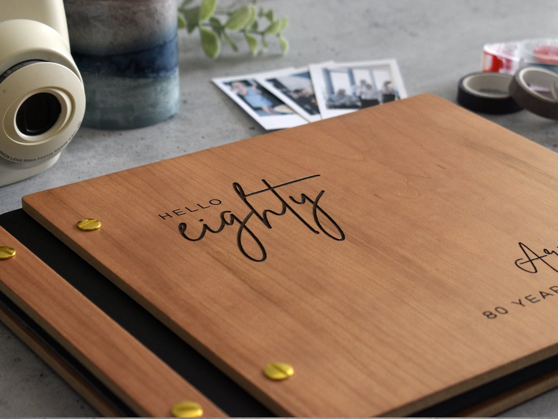 Engraved wooden birthday guest book in cherry finish with customized cover and minimalist design engraving.