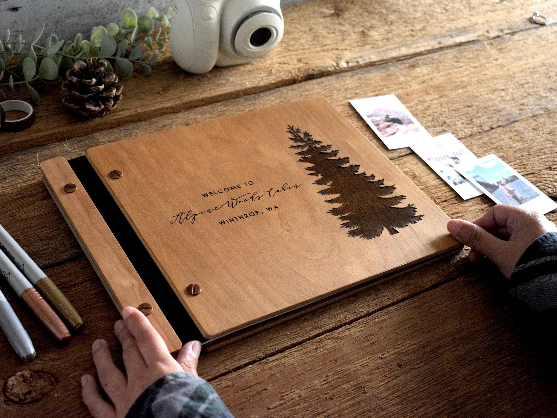 Custom Pine Tree Guestbook—perfect for Airbnbs and cabins. This book features personalized engraving on wood and captures the essence of your serene retreat.