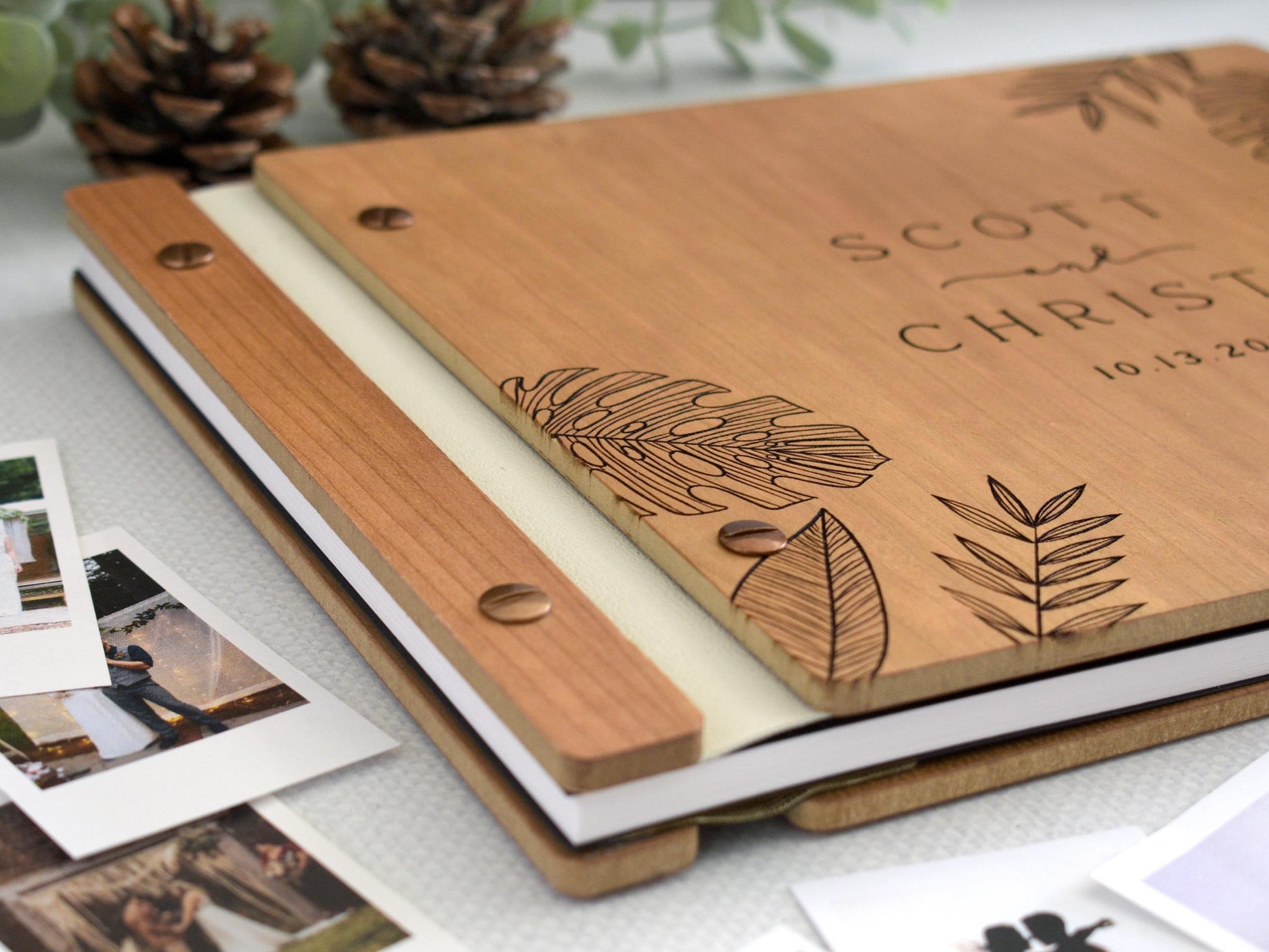 Custom wedding guest book engraved tropical leaf design. Fully customizable, it’s perfect for capturing special memories at weddings and significant events. for Polaroid photos, this guest book offers a unique and personalized keepsake.