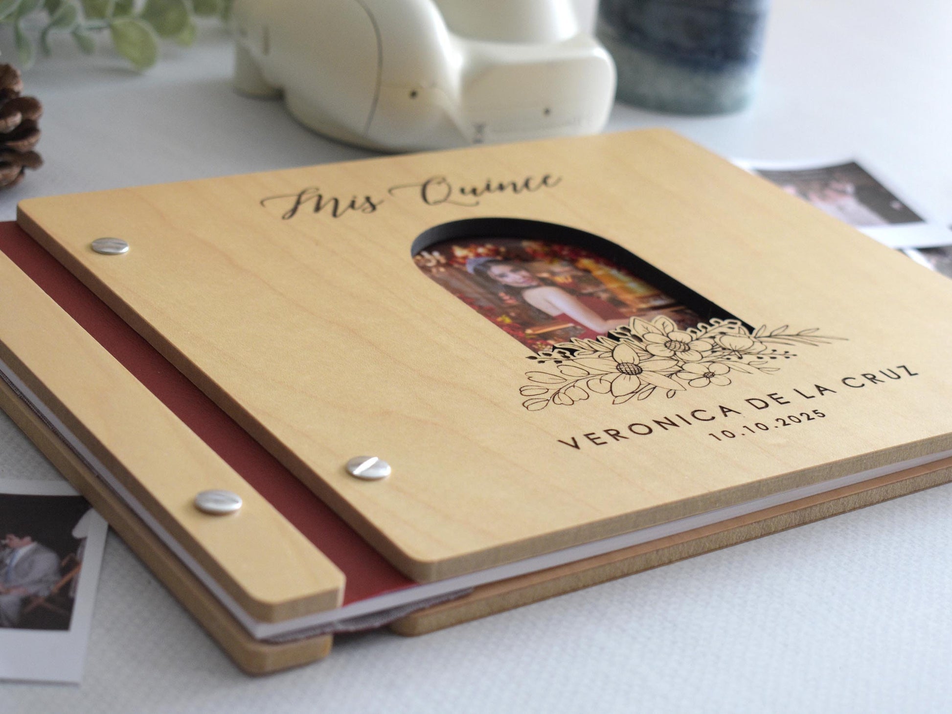 Customizable quinceañera guest book with a photo insert and engraved floral design on the cover. This wooden guest book is perfect for capturing memories and messages from friends and family during the celebration. Fully customizable photo and text.